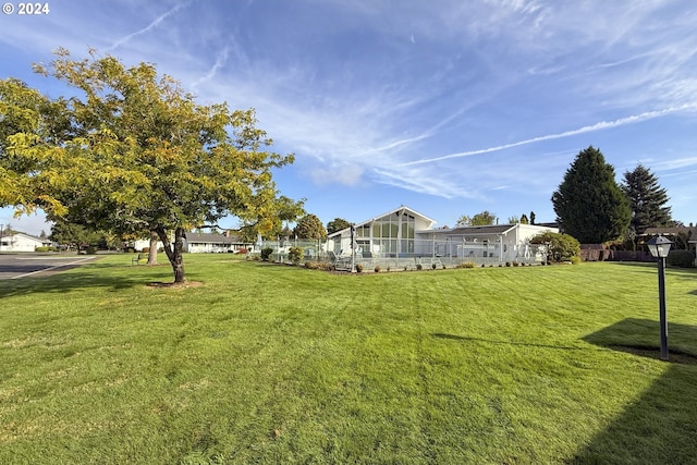 view of yard with a sunroom