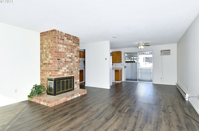 unfurnished living room with ceiling fan, dark hardwood / wood-style floors, a wall mounted AC, a brick fireplace, and a baseboard radiator