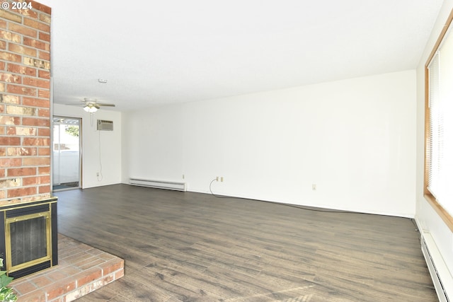 unfurnished living room with a brick fireplace, ceiling fan, a baseboard radiator, and dark hardwood / wood-style flooring