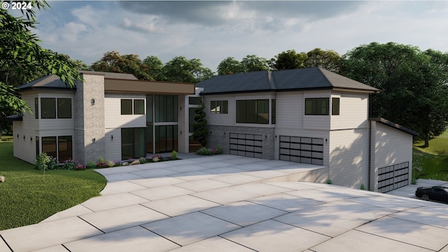 view of front facade with a garage and a front yard