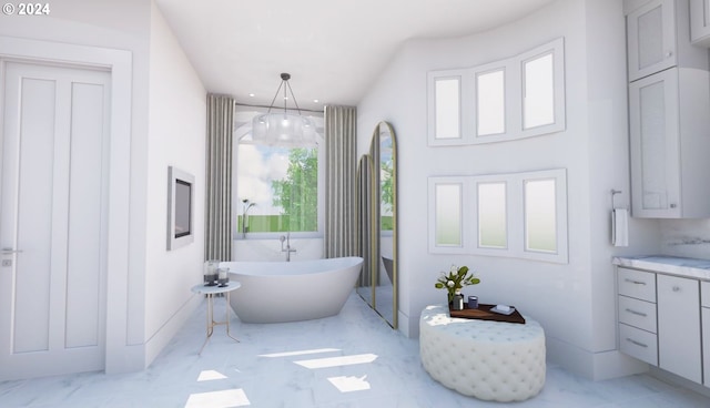 bathroom with a wealth of natural light, tile patterned flooring, a bathtub, and vanity