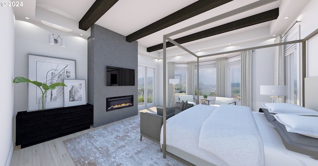 bedroom with a fireplace, beam ceiling, and hardwood / wood-style flooring