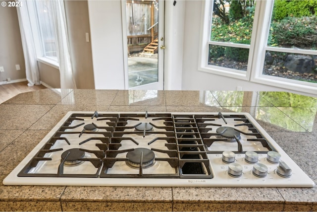 room details featuring white gas stovetop