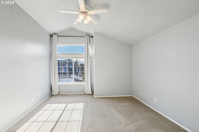 unfurnished room featuring light carpet, ceiling fan, and lofted ceiling