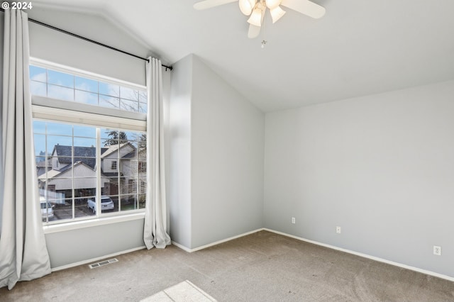 additional living space featuring light colored carpet, vaulted ceiling, and ceiling fan