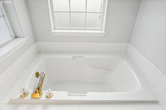 bathroom with tiled tub