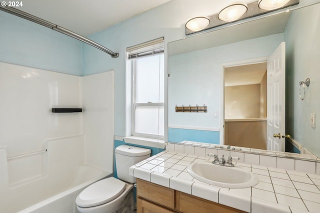 full bathroom featuring shower / bathing tub combination, vanity, and toilet