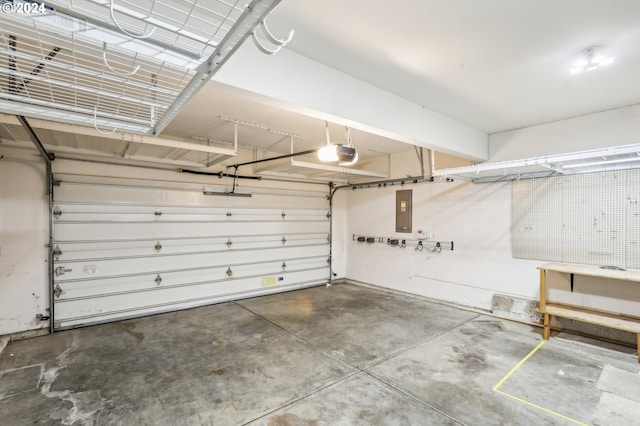 garage with electric panel and a garage door opener