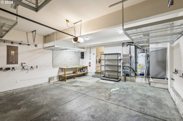 garage with electric panel, water heater, a garage door opener, and washer / dryer