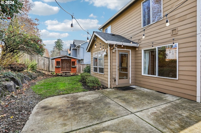 back of property featuring a yard and a patio