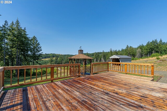 wooden deck featuring a gazebo