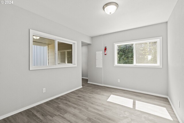 empty room with hardwood / wood-style flooring