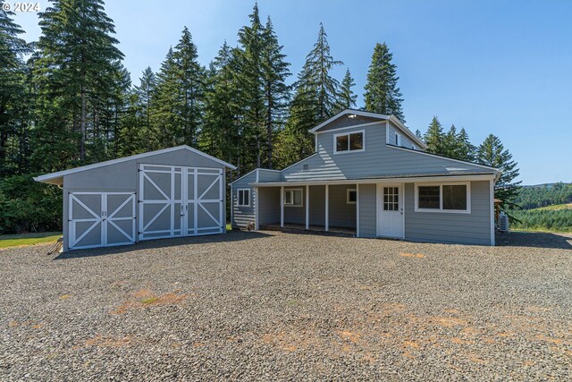 view of front of house with an outbuilding