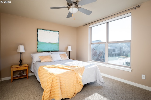 carpeted bedroom featuring ceiling fan