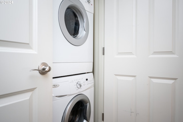 washroom featuring stacked washer and dryer