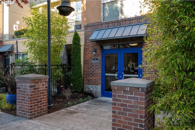 view of exterior entry featuring french doors