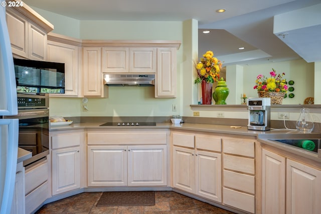 kitchen with black electric stovetop and oven