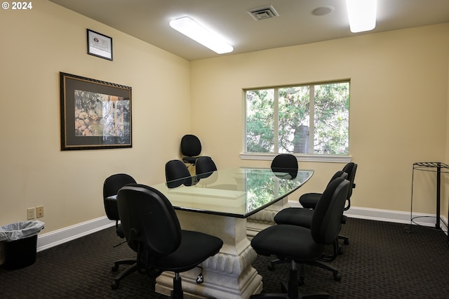 office space with dark colored carpet