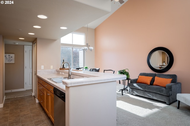 kitchen featuring sink, stainless steel dishwasher, tile counters, kitchen peninsula, and dark tile patterned flooring