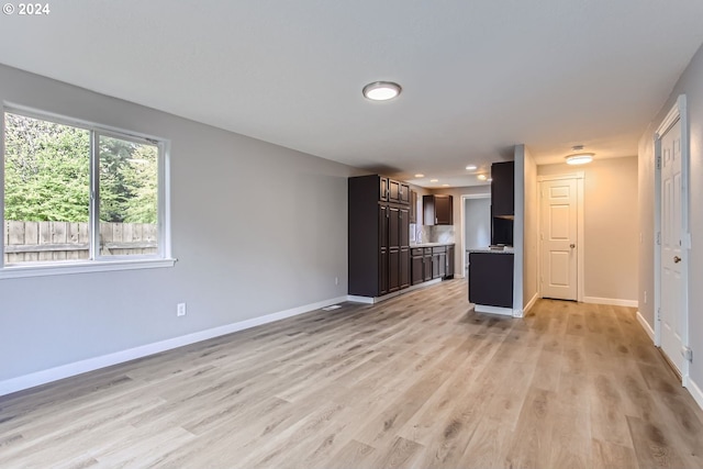 unfurnished living room featuring light hardwood / wood-style flooring