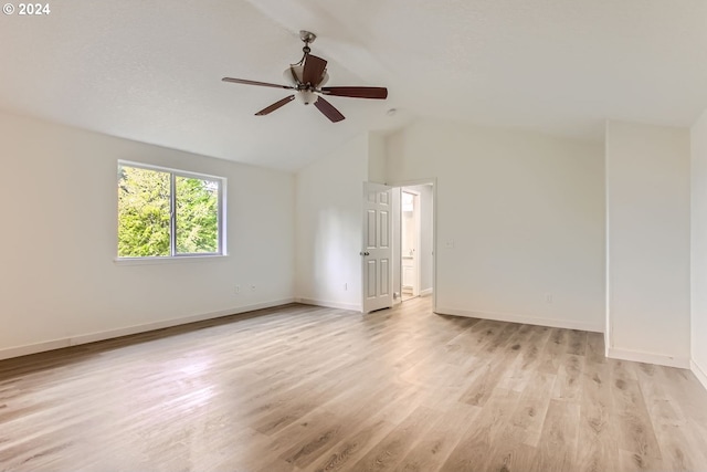 spare room with vaulted ceiling, ceiling fan, and light hardwood / wood-style floors