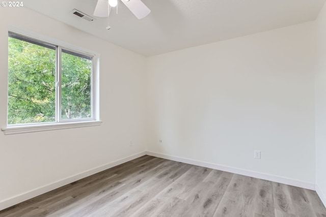 spare room with light hardwood / wood-style floors and ceiling fan