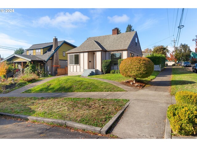 bungalow with a front yard