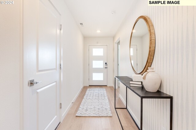 entryway with light hardwood / wood-style floors