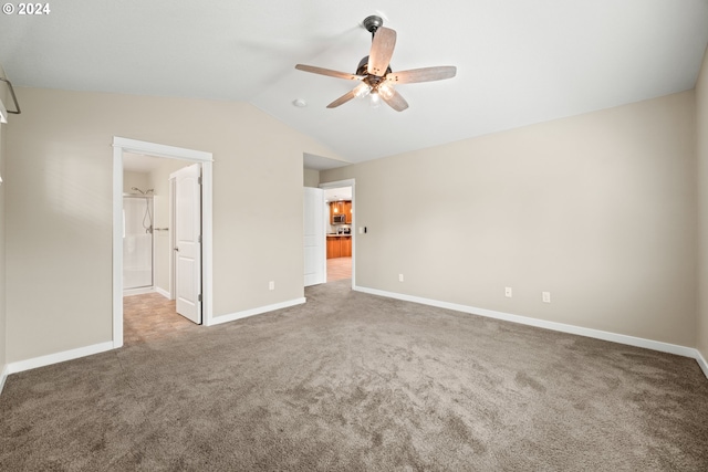 unfurnished bedroom with carpet, ceiling fan, and lofted ceiling