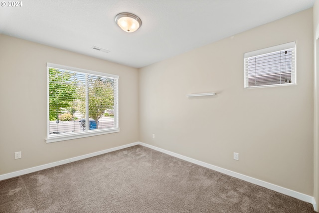 empty room with carpet flooring