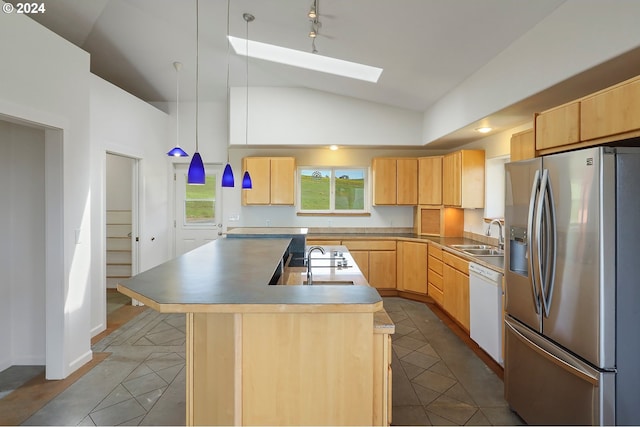 kitchen featuring white dishwasher, stainless steel refrigerator with ice dispenser, light brown cabinets, and a kitchen island with sink