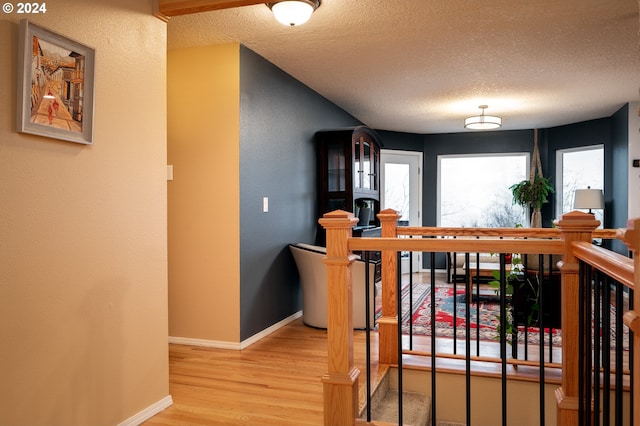 interior space featuring hardwood / wood-style floors and a textured ceiling