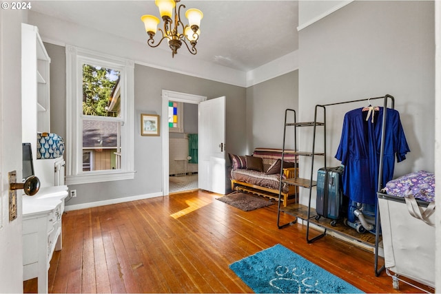 living area featuring a chandelier and hardwood / wood-style flooring