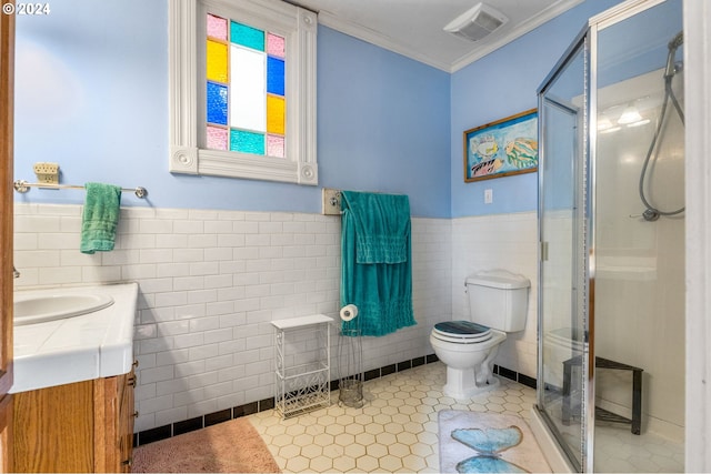 bathroom with tile walls, vanity, toilet, and walk in shower