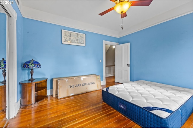 bedroom with wood-type flooring and ceiling fan