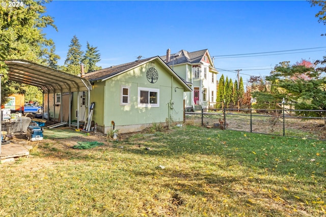 view of property exterior with a lawn and a carport