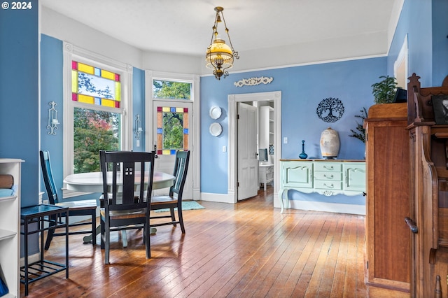 dining room with a chandelier and hardwood / wood-style floors