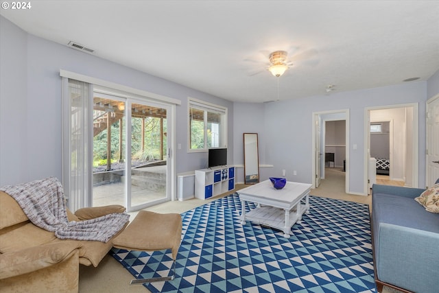 carpeted living room with visible vents