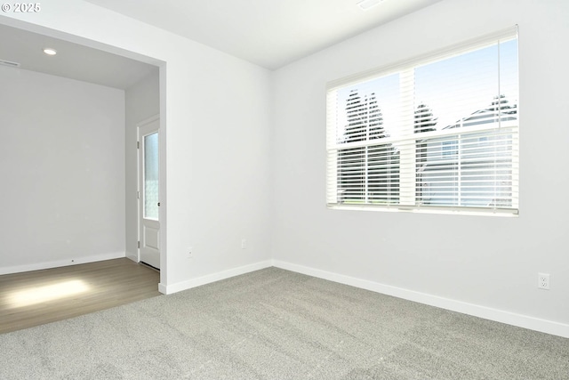 empty room with carpet flooring