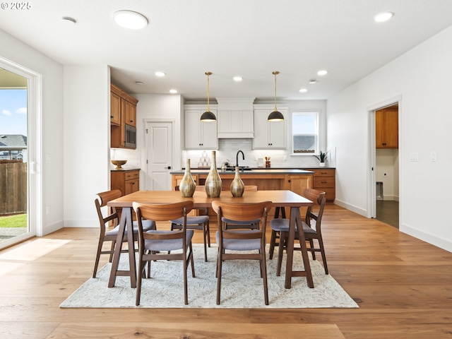 dining room with light wood-type flooring