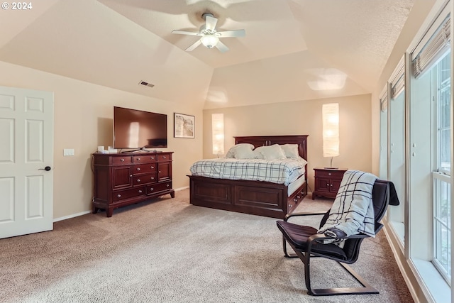 carpeted bedroom featuring ceiling fan and vaulted ceiling