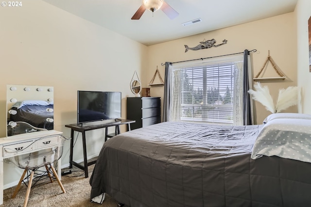 carpeted bedroom with ceiling fan