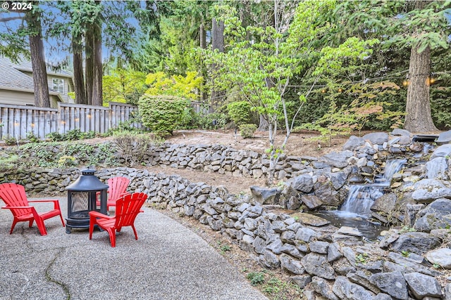 view of patio / terrace with an outdoor fire pit