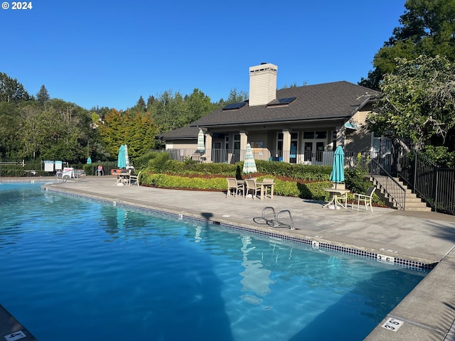 view of pool featuring a patio