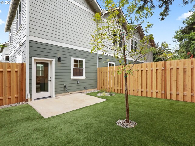 exterior space featuring a lawn and a patio