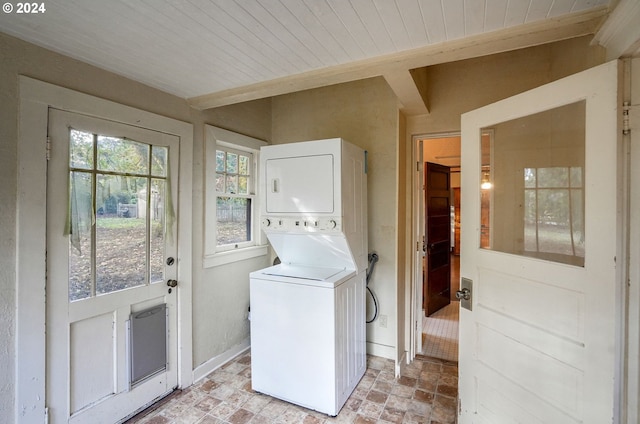 washroom with stacked washer / dryer