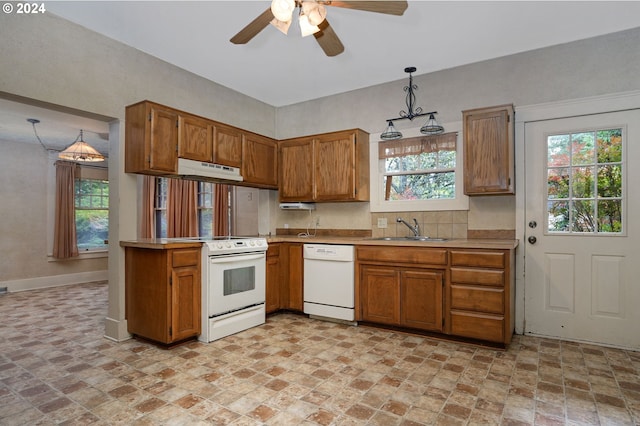 kitchen with white appliances, ceiling fan, sink, and decorative light fixtures