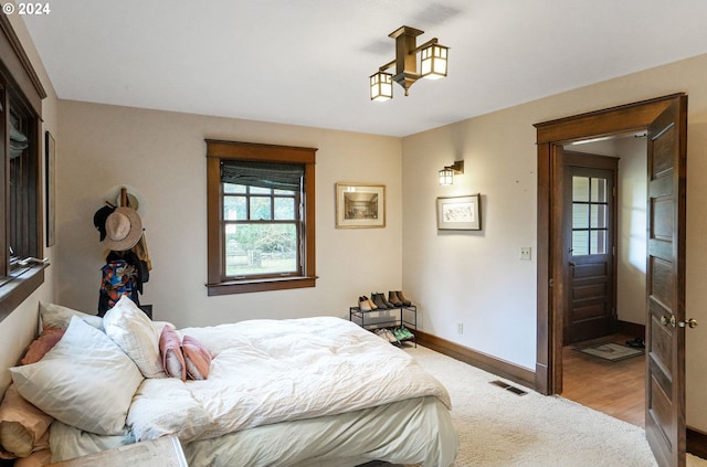 bedroom featuring light wood-type flooring