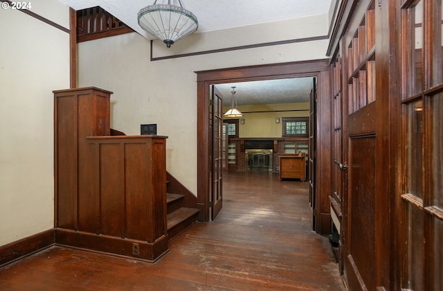 hall with dark hardwood / wood-style floors