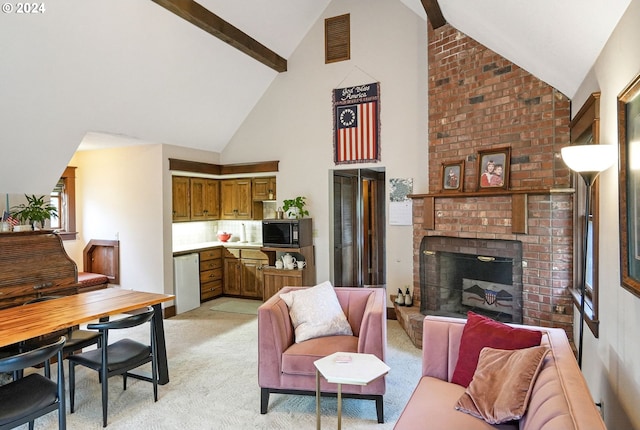 carpeted living room featuring a fireplace, beamed ceiling, sink, and high vaulted ceiling